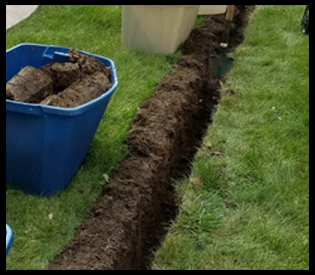 One Shot Shovel cutting a clean, straight trench through a lawn